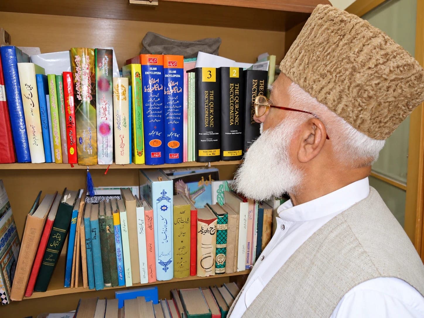 Looking through the library shelves.